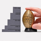 all-groups Size comparison of NFL American Football Ring Box next to ruler